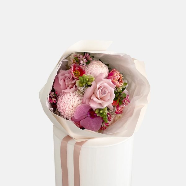 A posy of pink flowers, tulips, poppies, roses, disbuds, snap dragons, phalaenopsis orchid flower. LULLY & ROSE Floral Studios Signature posies available for same day flower delivery Gold Coast