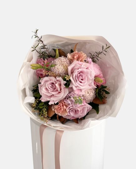 A posy of vintage pink and peach flowers, carnations, stock, roses, disbuds. LULLY & ROSE Floral Studios Signature posies available for same day flower delivery Gold Coast