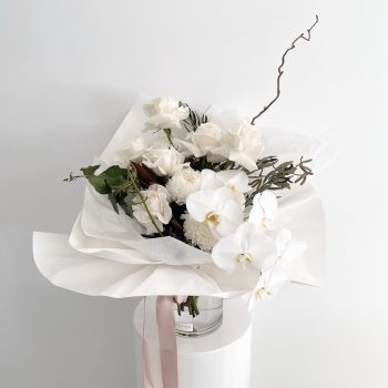 Flowers-for-a-sympathy-arrangement-white-roses-and-orchid-bouquet-arranged-in-a-vase-gold-coast