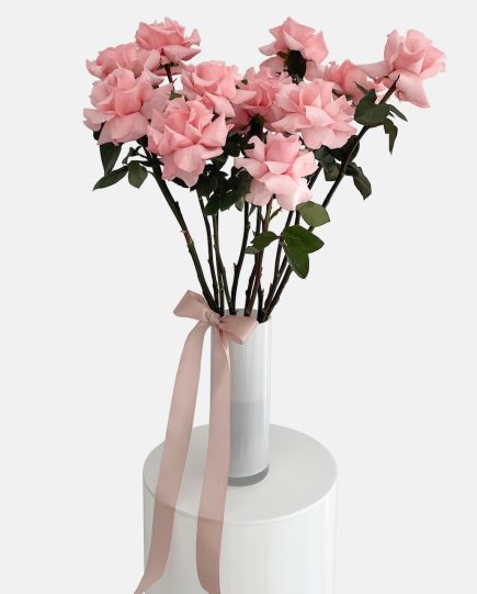 Pink reflexed Ecuadorian roses arranged in a white glass marmoset found vase, finished with rose gold ribboning. For same day flower delivery on the Gold Coast