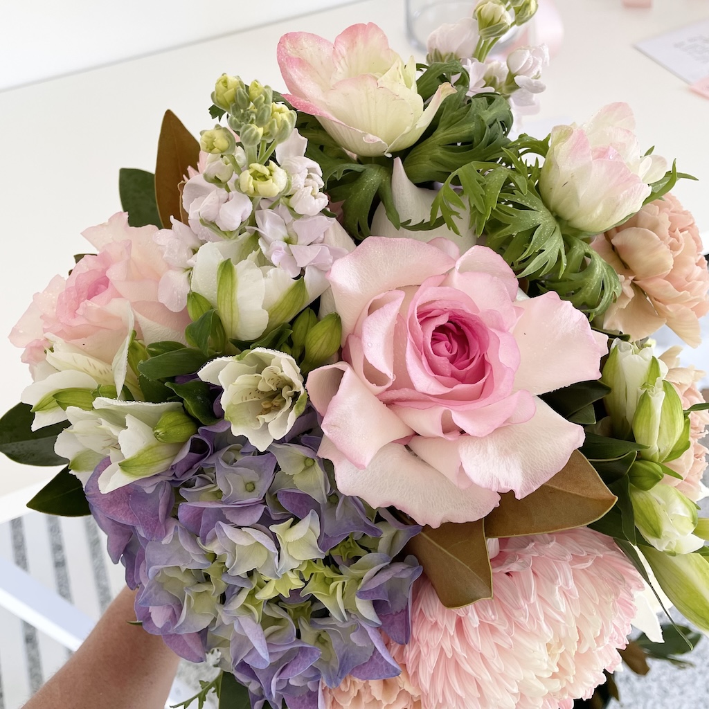 Posy of flowers with pink reflex roses, blue hydrangea and white flowers for worongary flower delivery Gold Coast