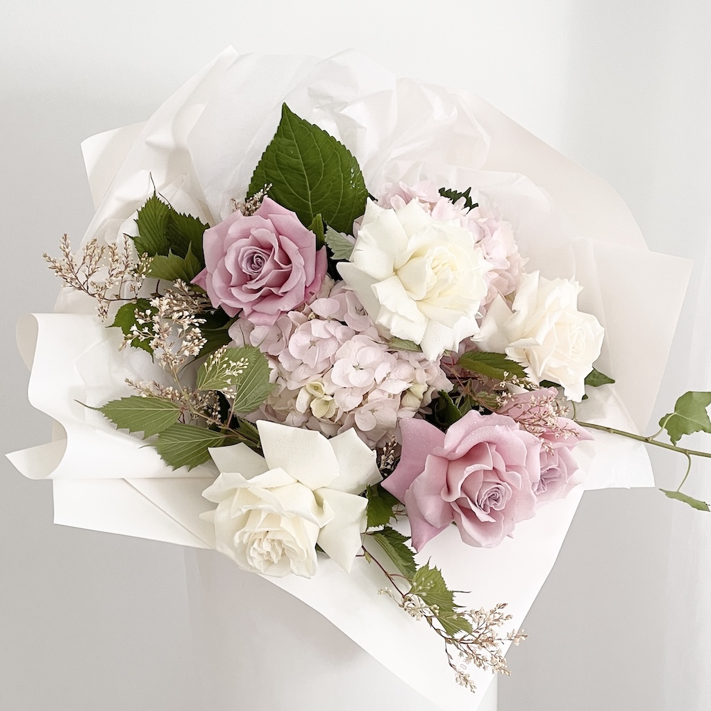 Bouquet arrangement of white and vintage pink roses and soft pink hydrangea from Gold Coast Private Hospital florist