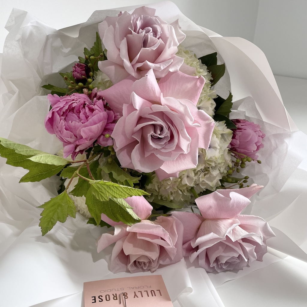 Bouquet of pink peonies, pink roses, and white hydrangea. Create an account with LULLY &amp; ROSE for all your flower arrangements on the Gold Coast
